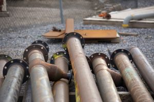 A pile of metal pipes in the construction site